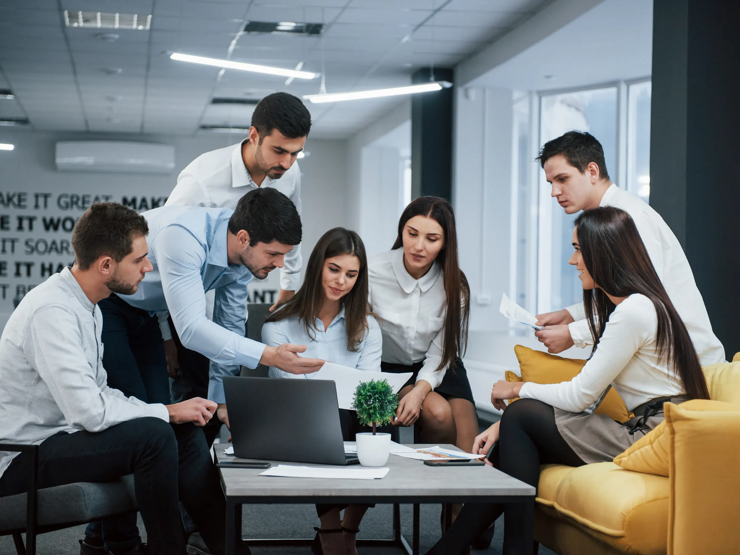 Team reviewing candidate profiles together in an office